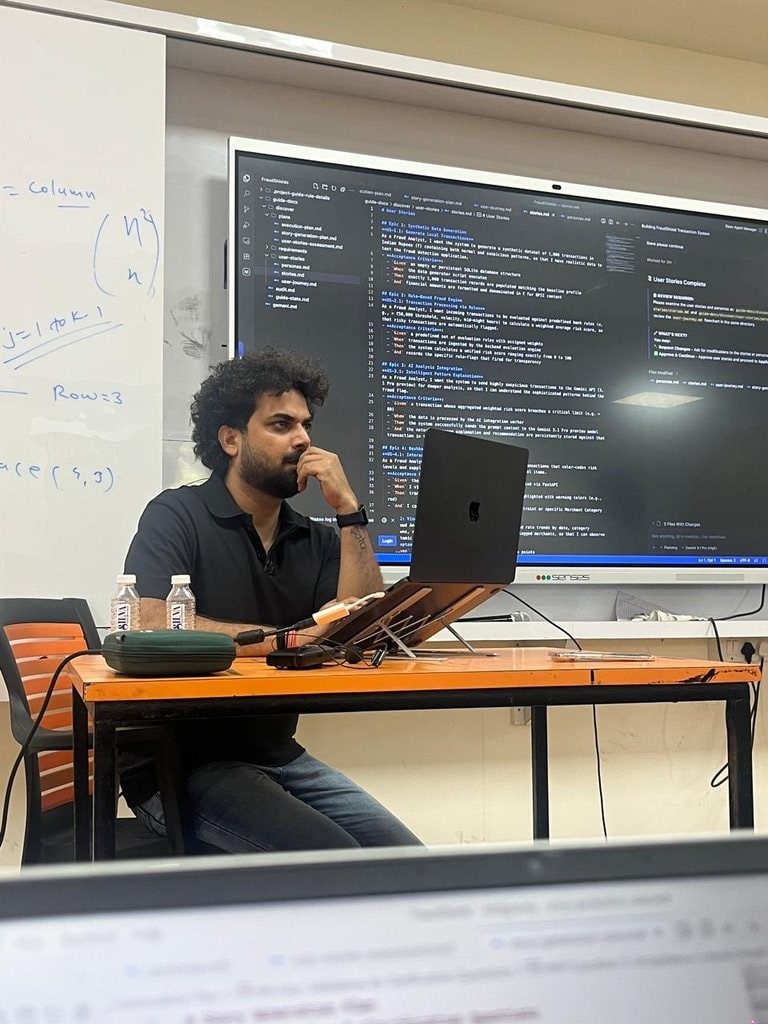 A build session with the system plan on the screen behind the room