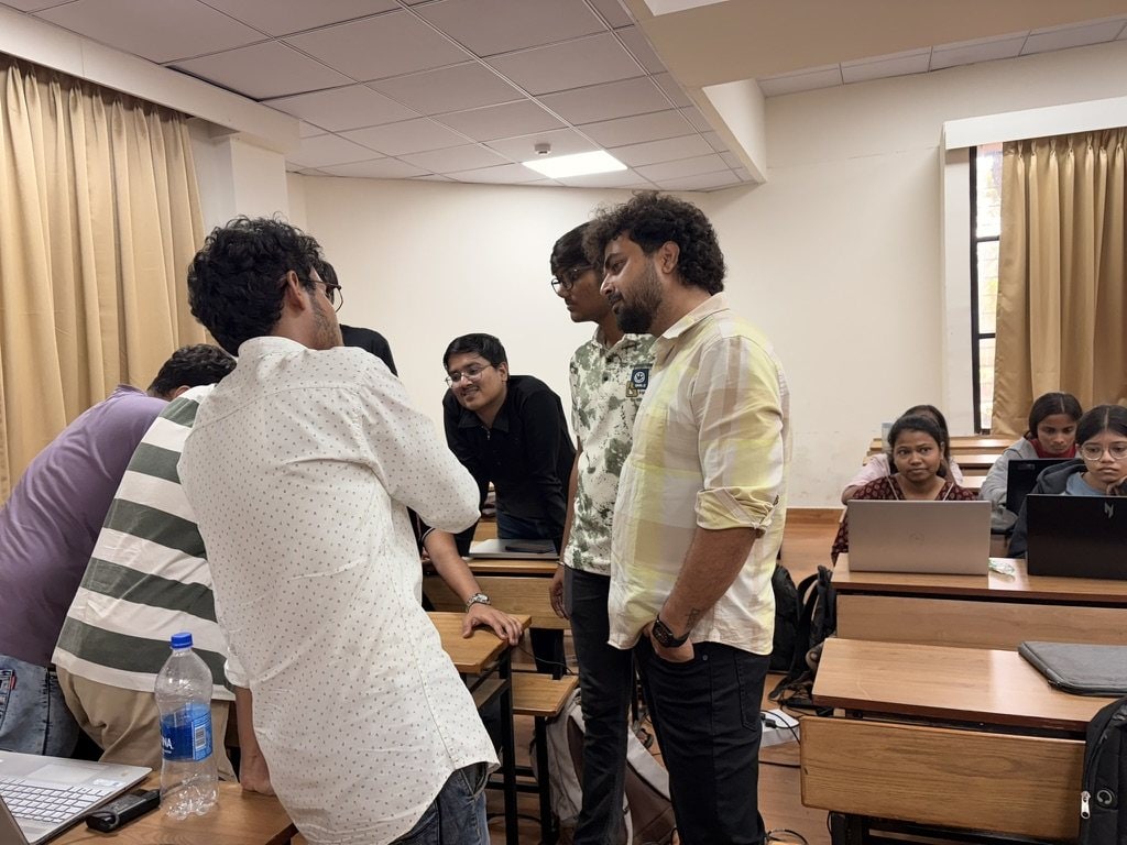 Students gathered around Ashish Tripathi during a workshop at S.P.I.T. Mumbai