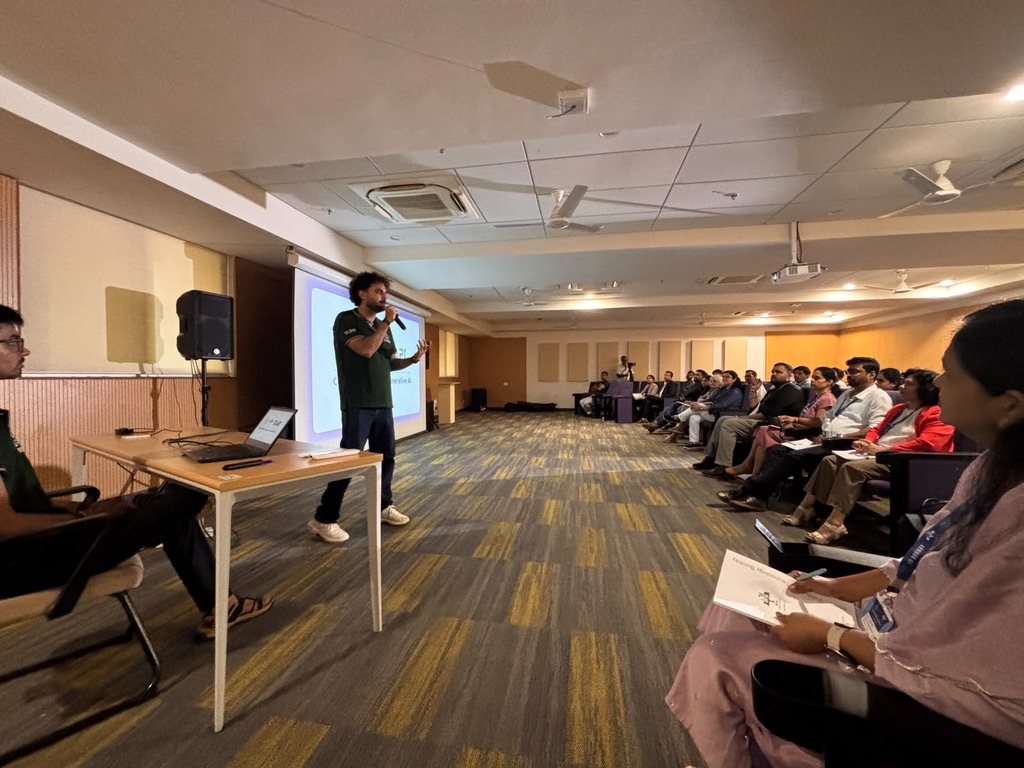 Ashish Tripathi speaking to a seated audience at an IIT Bombay programme