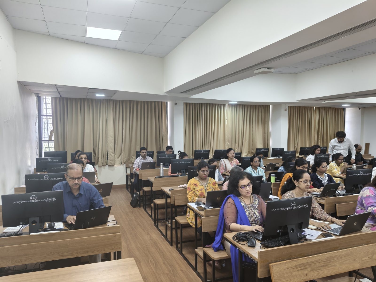 Faculty members working at their terminals during the S.P.I.T. Faculty Development Programme